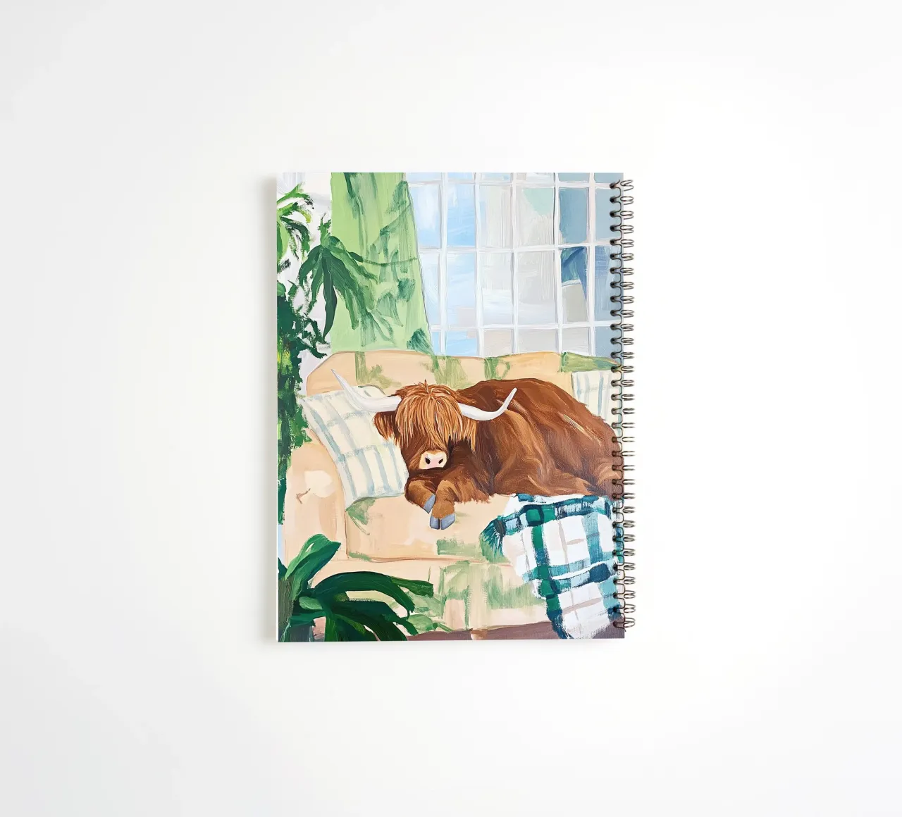 Mucca Highland sul divano diario ad anelli da Nikis Art Studio