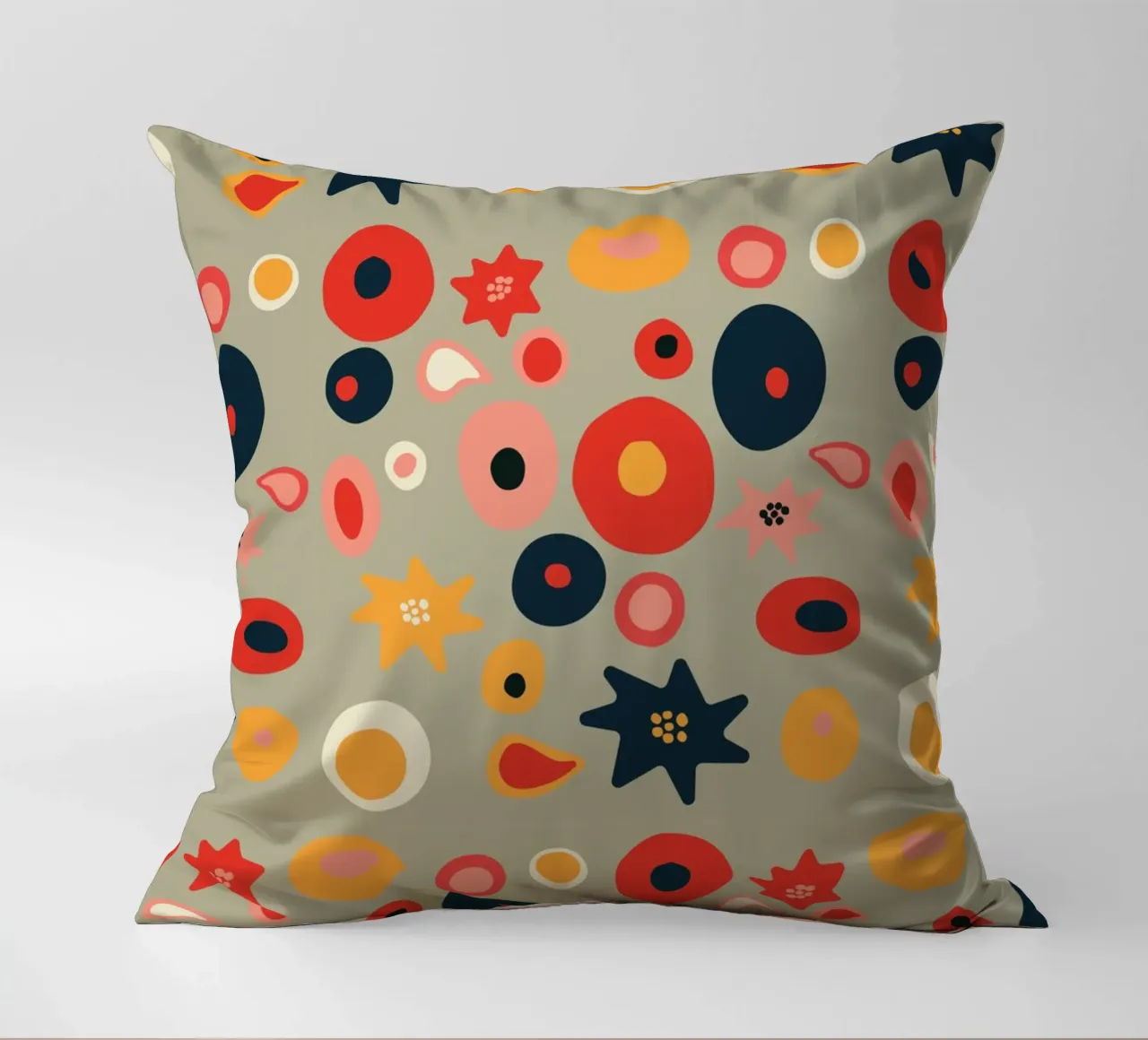 Playful flower and shape pattern in red and gold decorative cushion by Spunk