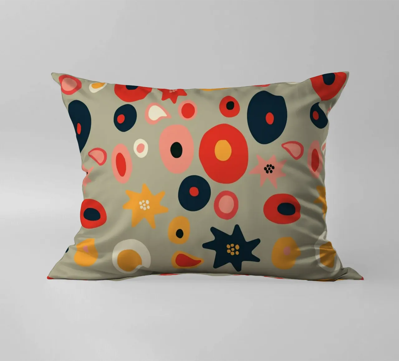 Playful flower and shape pattern in red and gold decorative cushion by Spunk