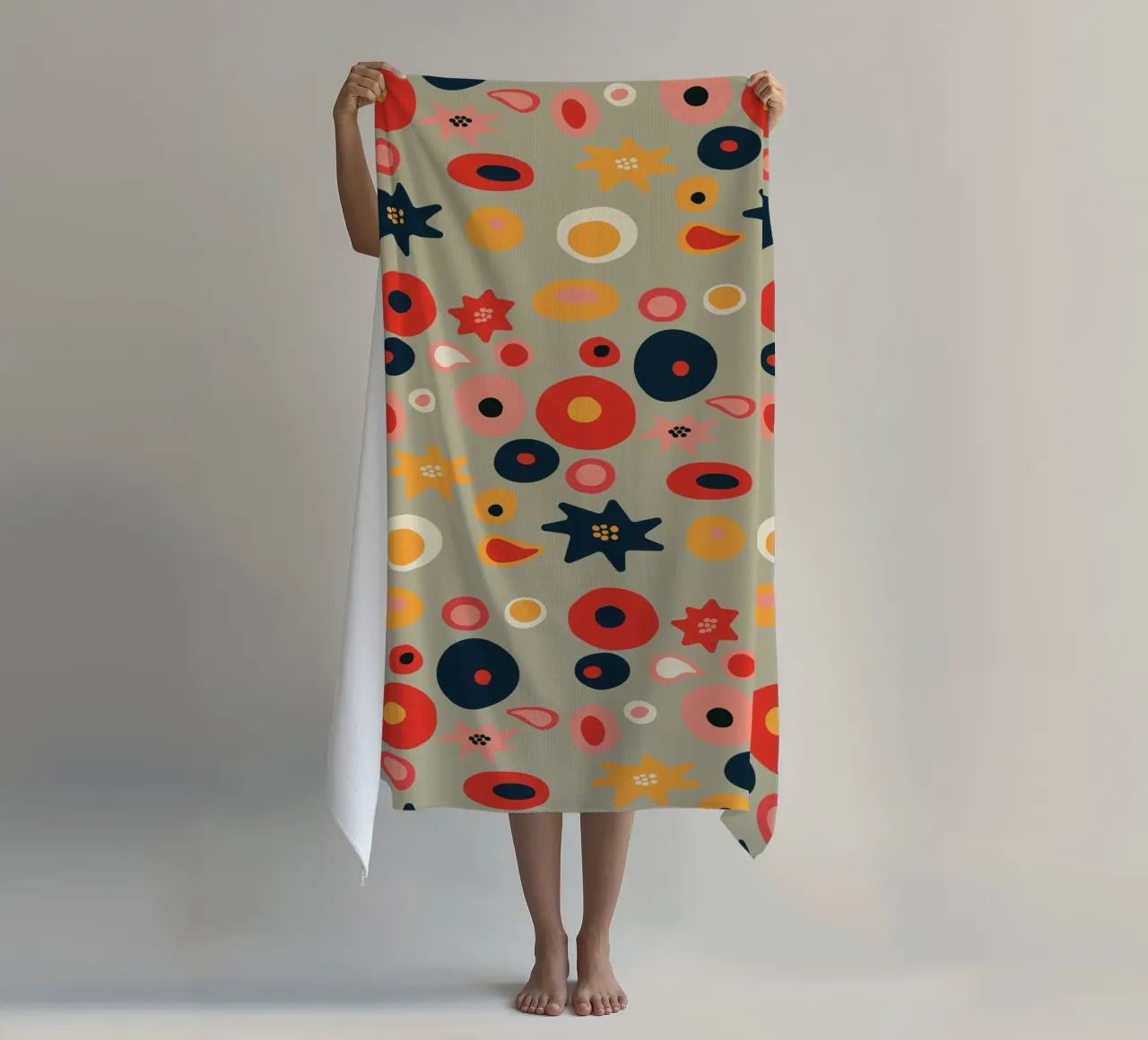 Playful flower and shape pattern in red and gold beach towel by Spunk