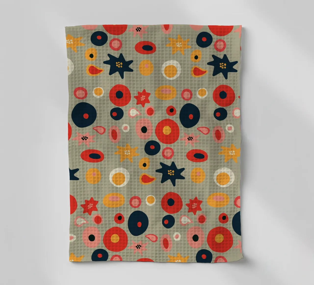 Playful flower and shape pattern in red and gold tea towel by Spunk