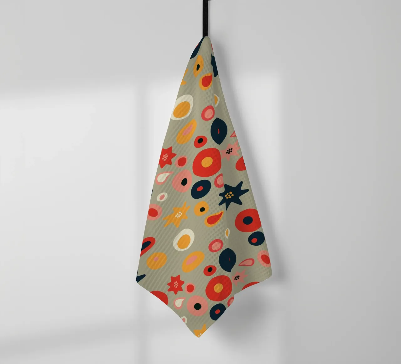 Playful flower and shape pattern in red and gold tea towel by Spunk