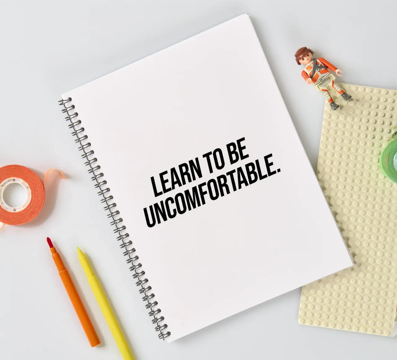 Learn to be uncomfortable quote spiral notebook by Paigaam Studio