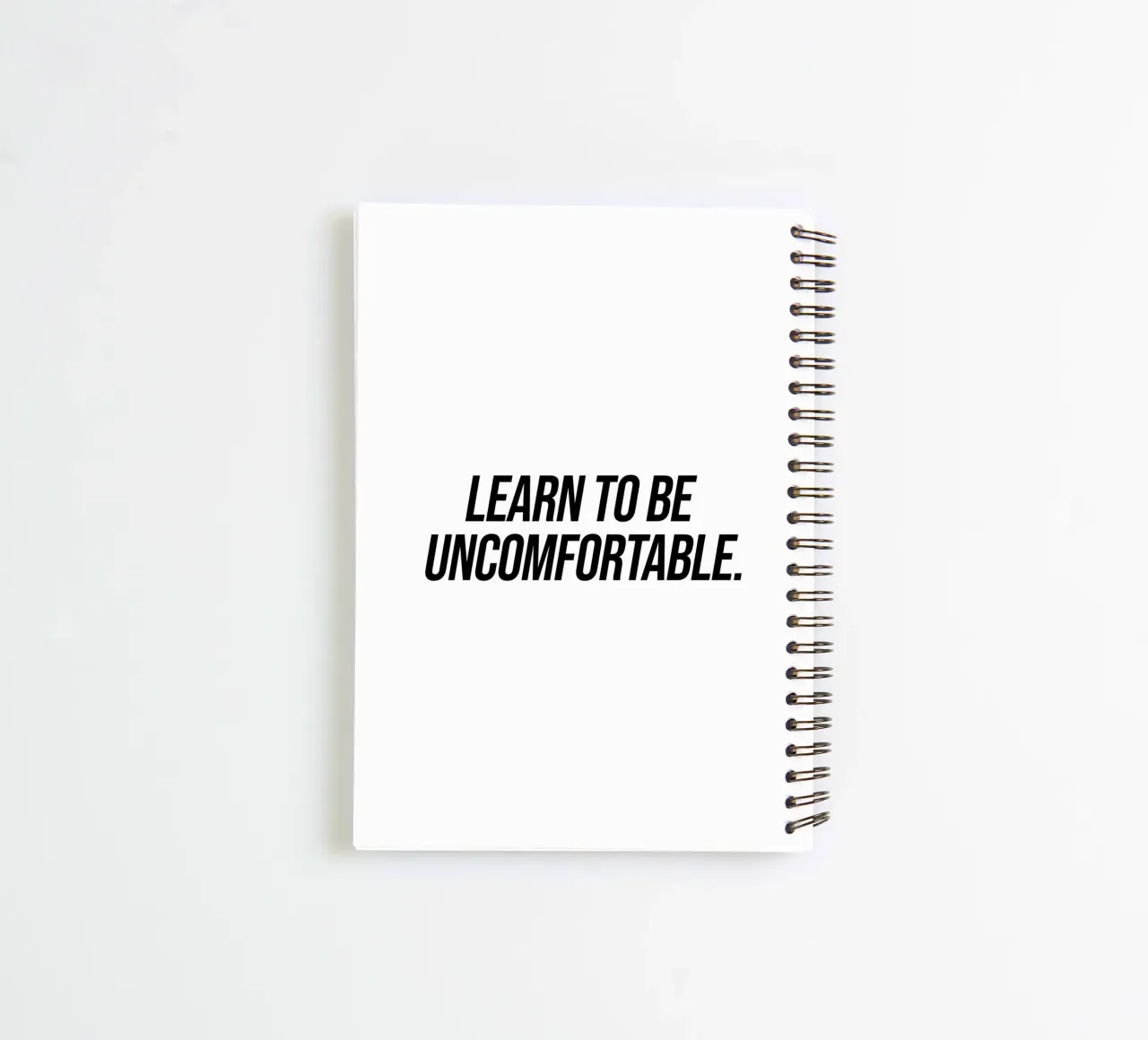 Learn to be uncomfortable quote spiral notebook by Paigaam Studio