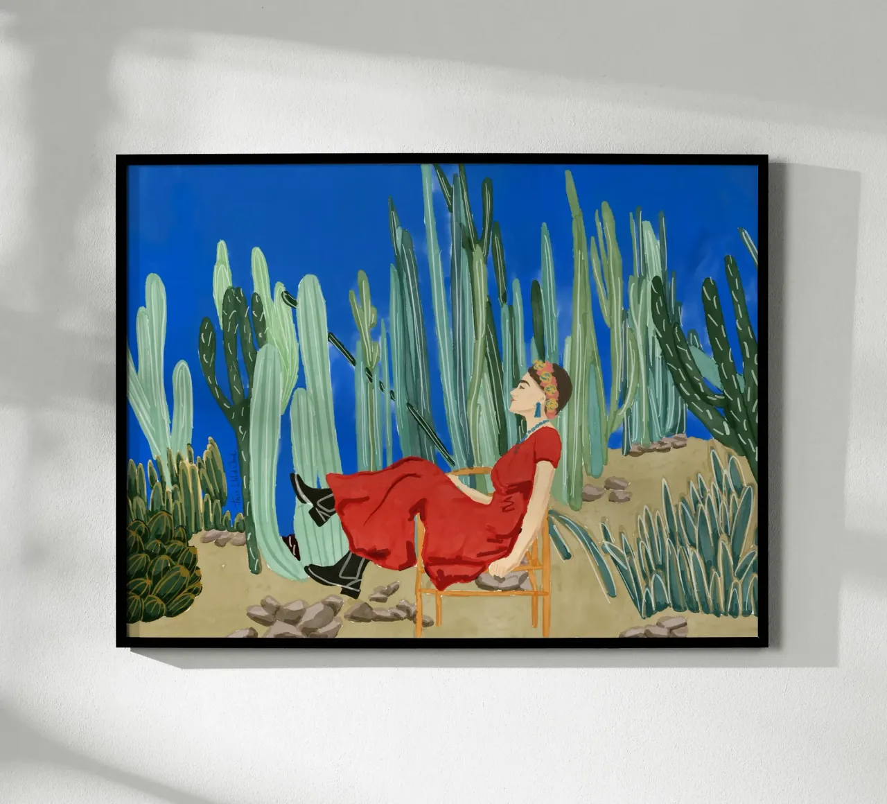 Frida Khalo nel suo giardino di cactus blu La Casa Azul poster con telaio in plastica da This Wild Soul - Illustration