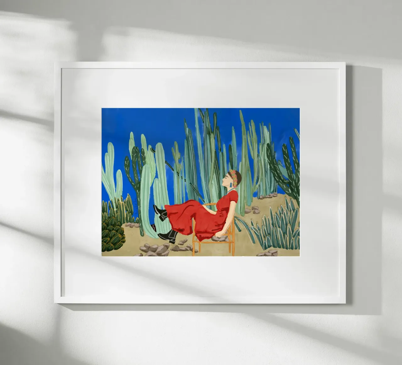 Frida Khalo nel suo giardino di cactus blu La Casa Azul poster con telaio in plastica da This Wild Soul - Illustration
