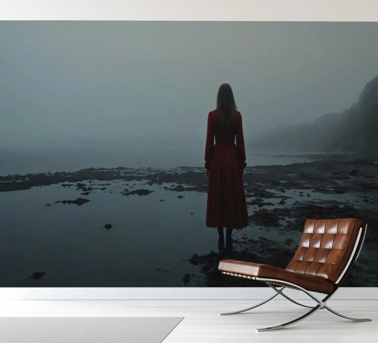 Une femme vêtue d'une robe rouge se tient debout, contemplative, au bord d'une rivière brumeuse. papier peint photo de DesignDoodle