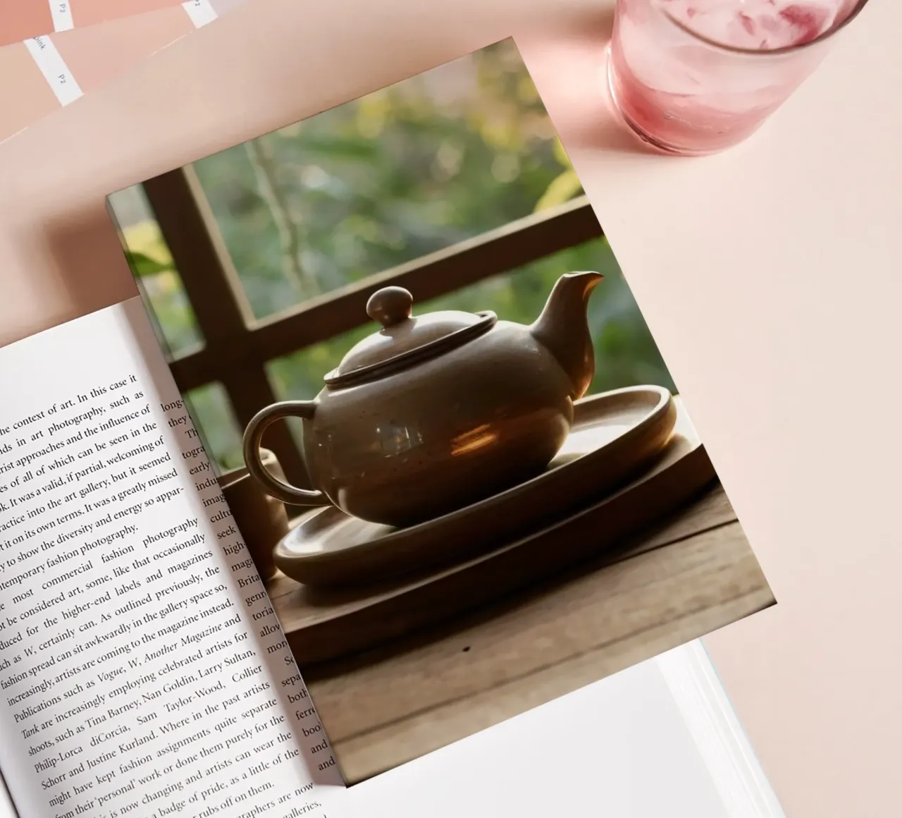 serene tea setup on a wooden table surrounded by lush green notebook by DesignDoodle