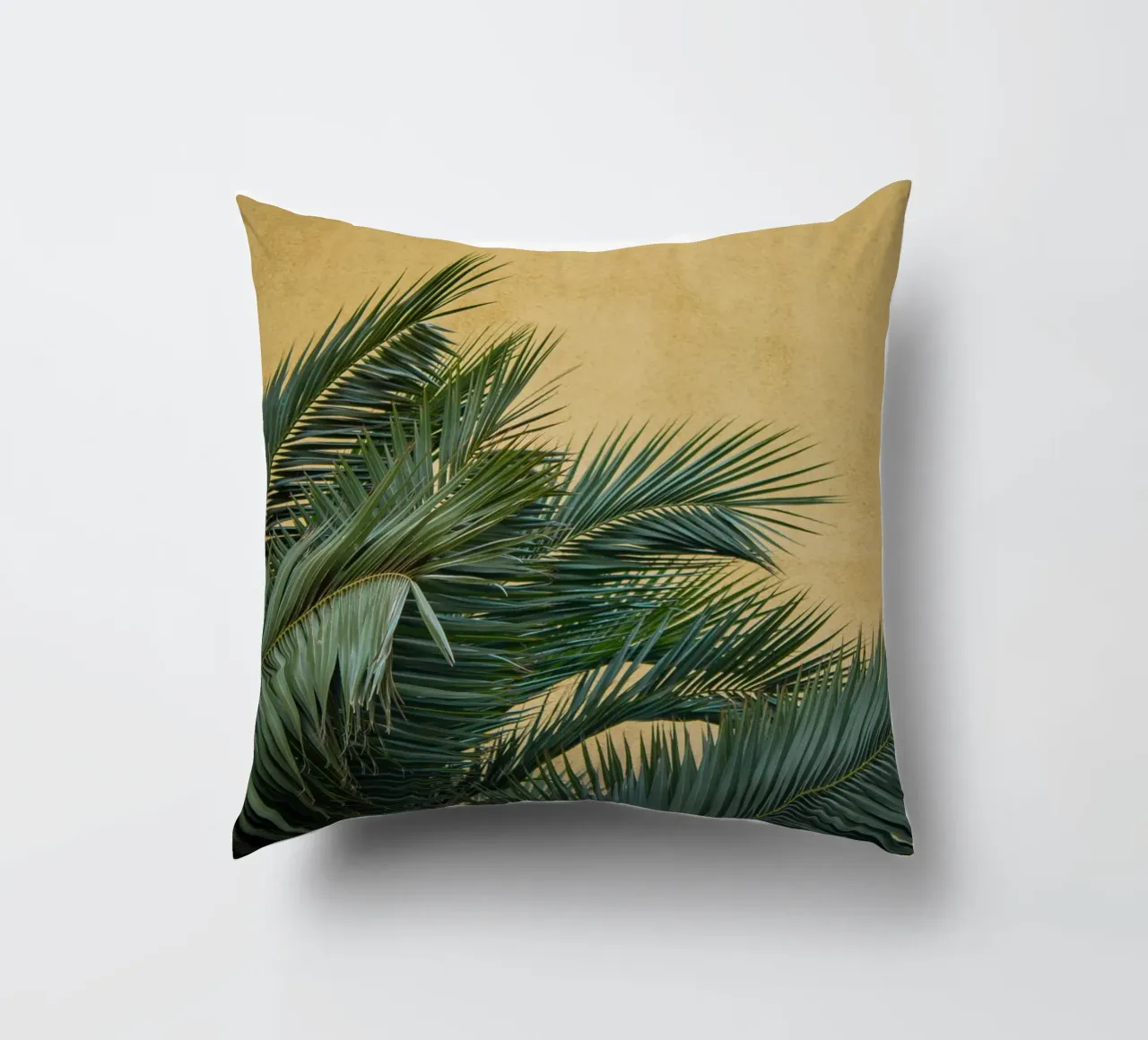 Golden Palm Leaves decorative cushion by Victoria Frost