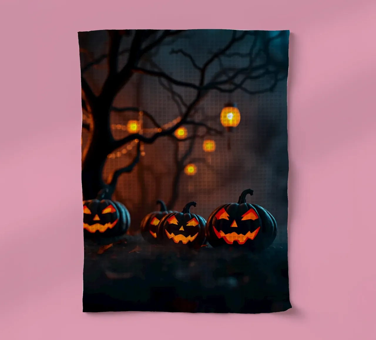 Les citrouilles d'Halloween brillent sous la lumière d'une lanterne dans l'obscurité torchon de DesignDoodle