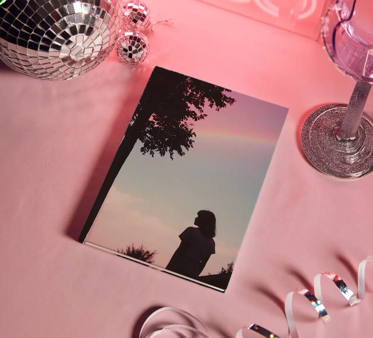 silhouette of a girl under a summer sky with a rainbow notebook by serinae
