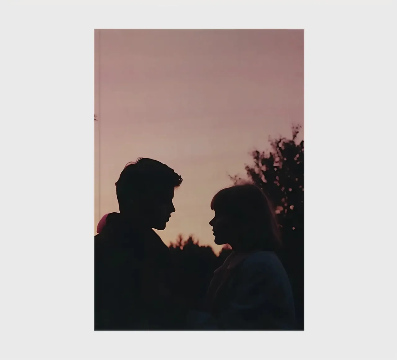 silhouette of a couple looking at each other notebook by serinae