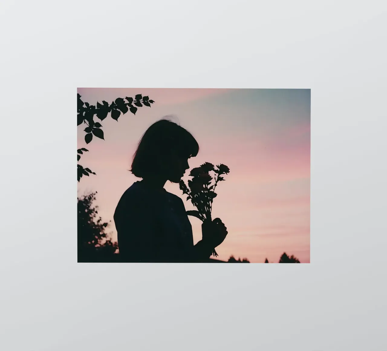 silhouette of a girl smelling a bunch of flowers sticker by serinae