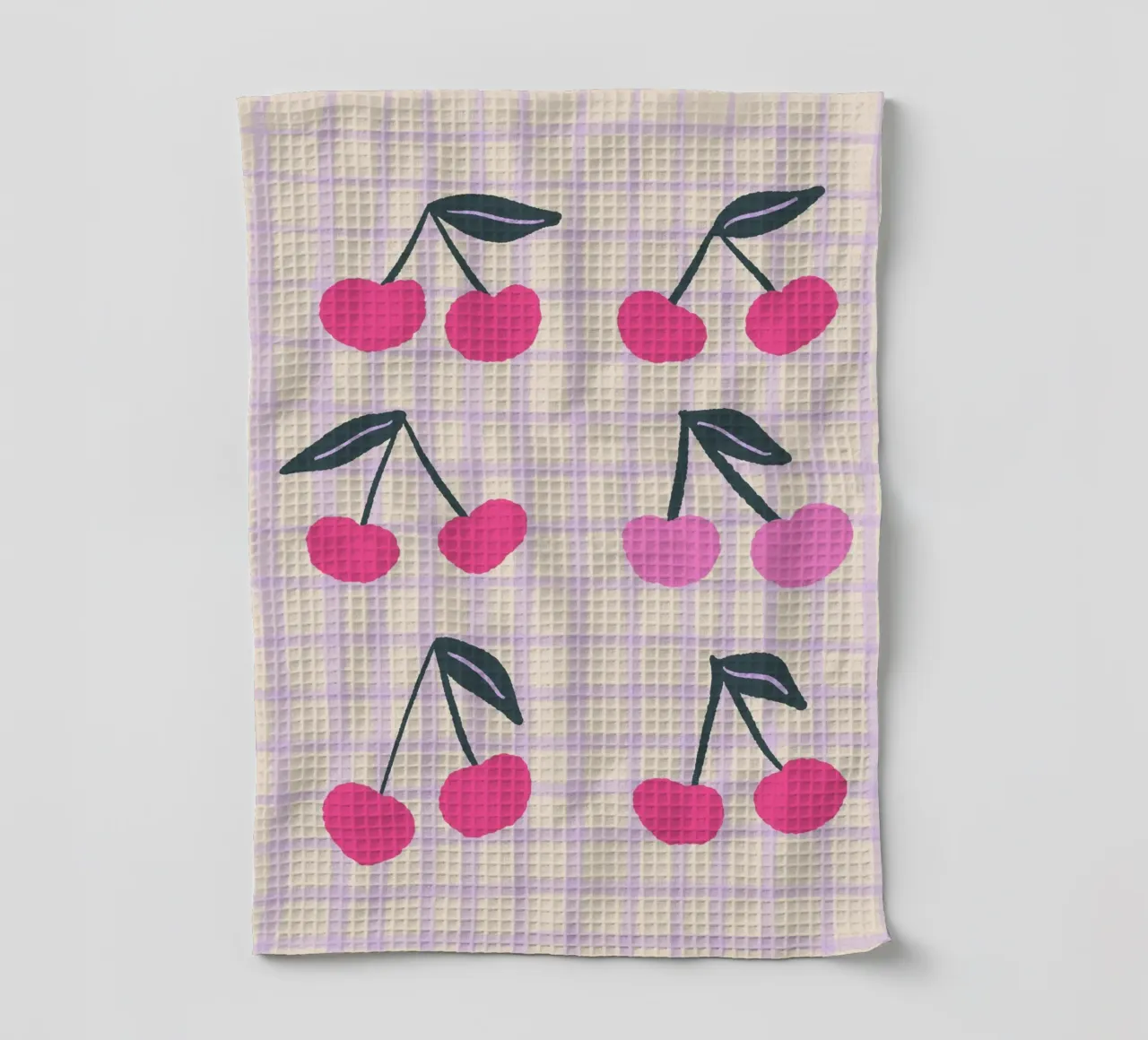 Abstract cherries on a grid pattern tea towel by Wackapacka