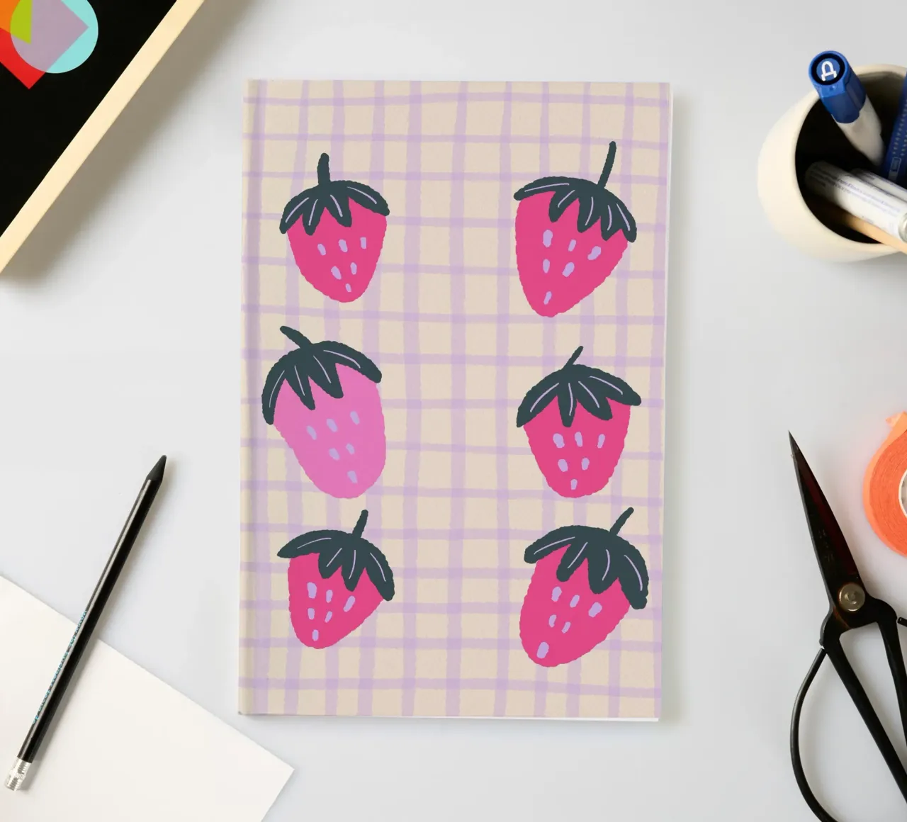 Abstract strawberries on a grid pattern notebook by Wackapacka