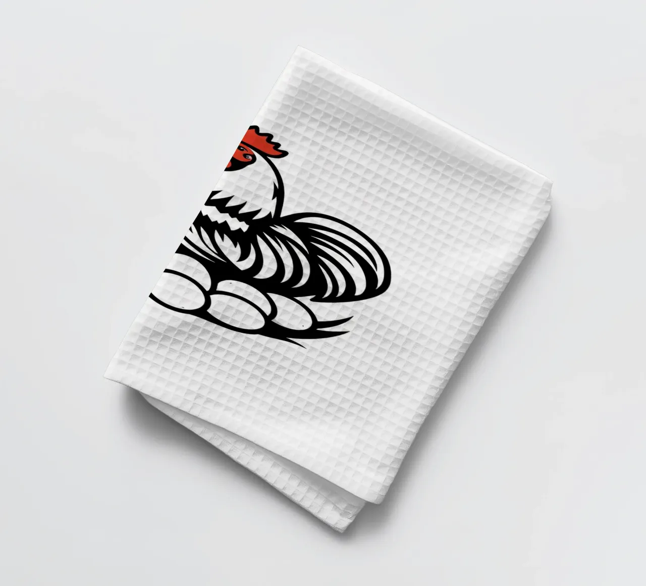 Ein Hahn steht stolz über einem Nest mit weißen Eiern Geschirrtuch von DesignDoodle