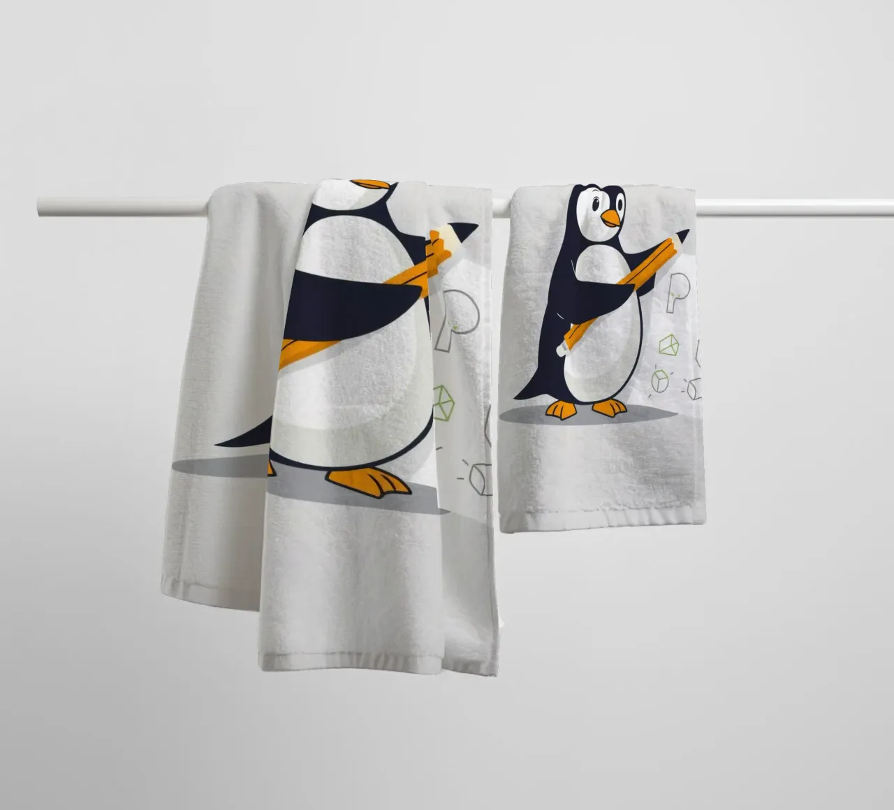 A cartoon penguin drawing shapes and letters towel by DesignDoodle
