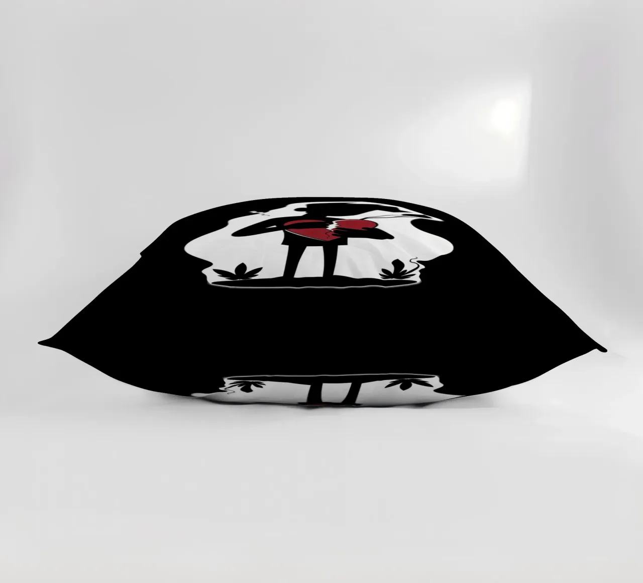 Una figura affranta tiene un cuore in frantumi cuscino da DesignDoodle