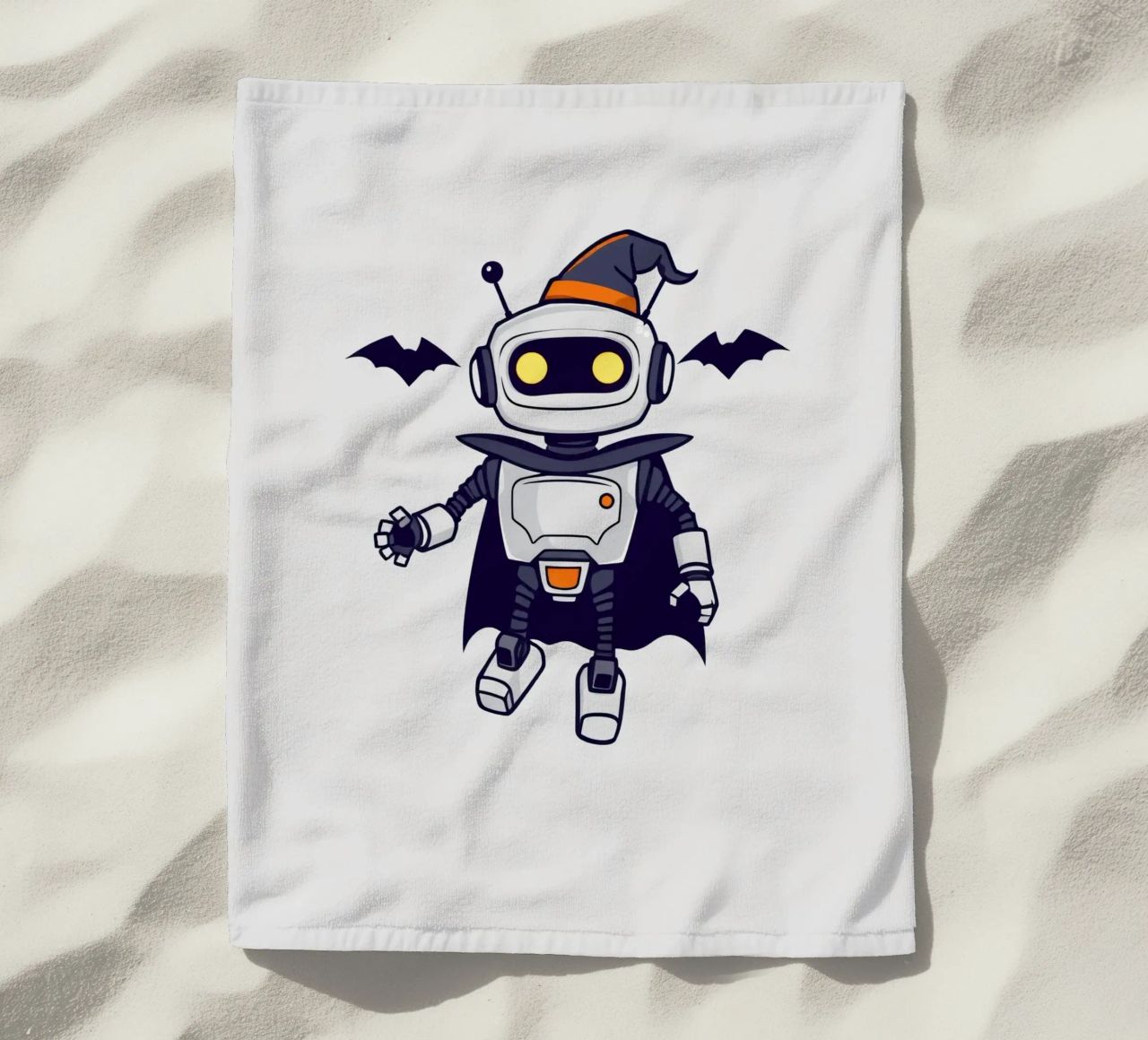 Un juguetón robot disfrazado de Halloween con capa toalla de playa de DesignDoodle