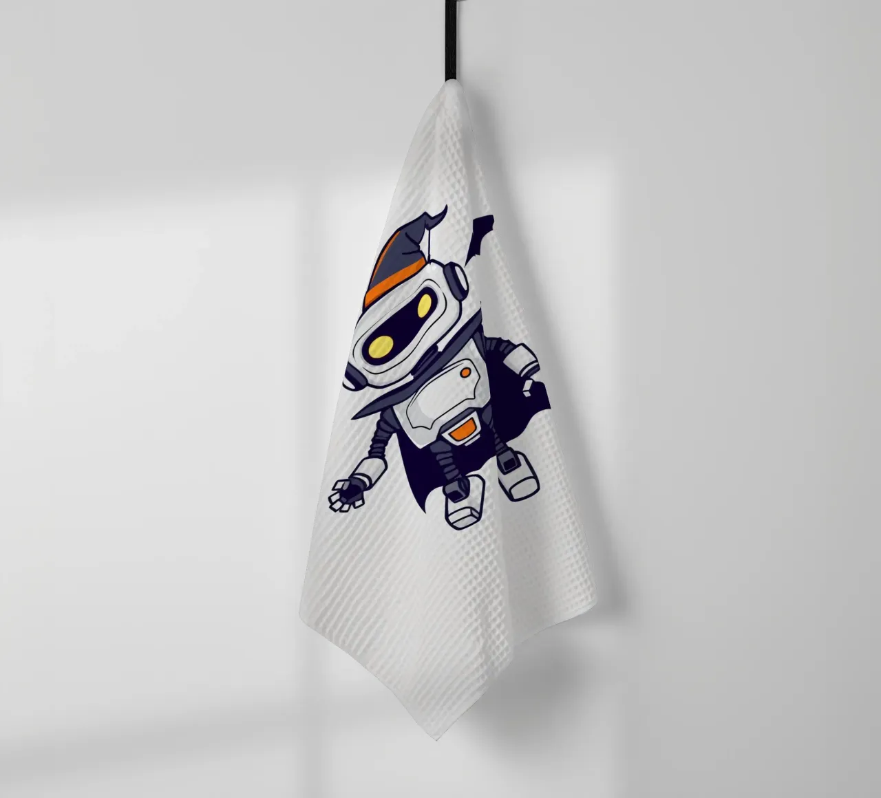 Un robot giocoso in costume di Halloween, con tanto di mantello canovaccio da cucina da DesignDoodle