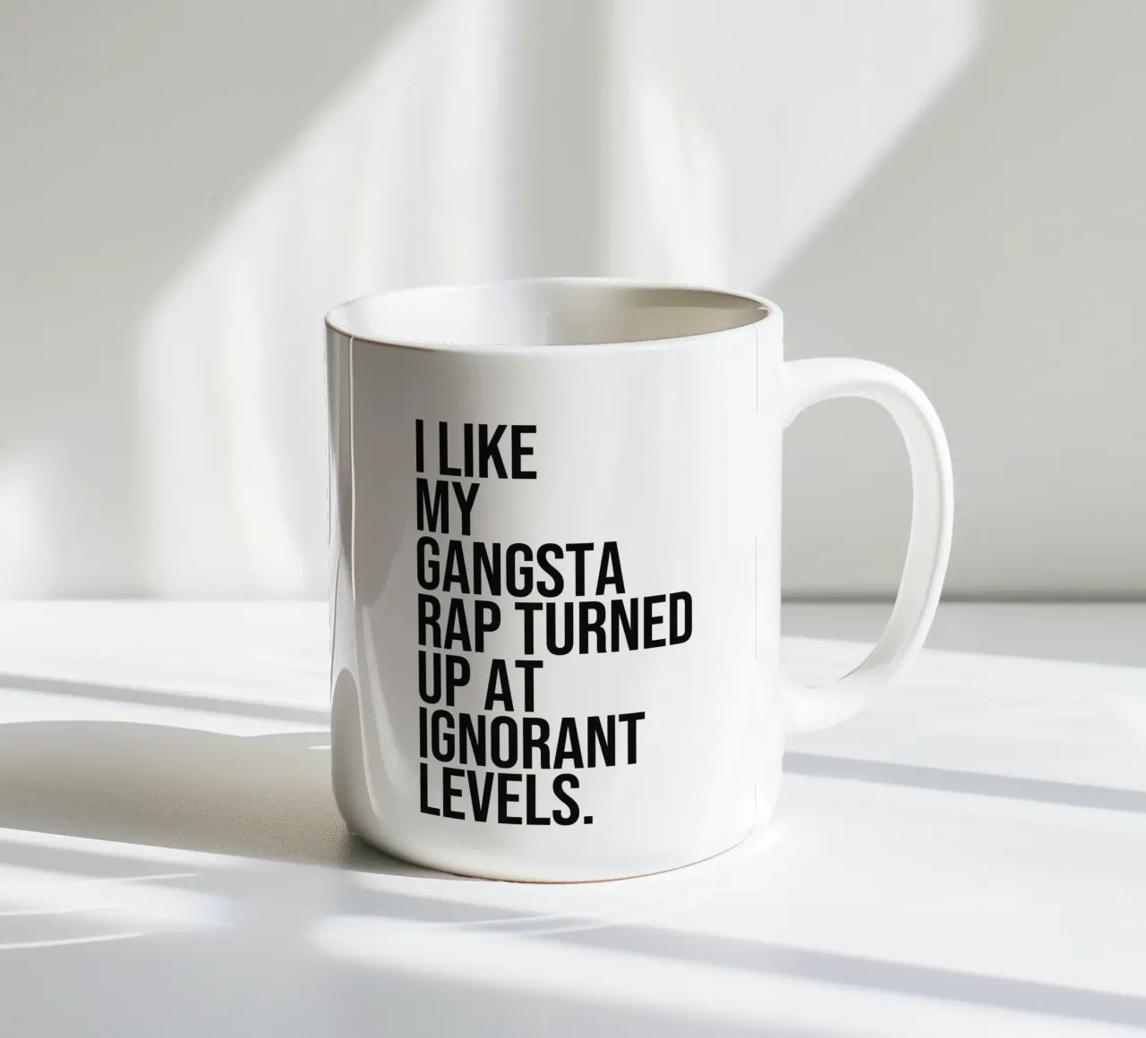 I like my gangsta rap turned up at ignorant levels quote ceramic mug by Paigaam Studio