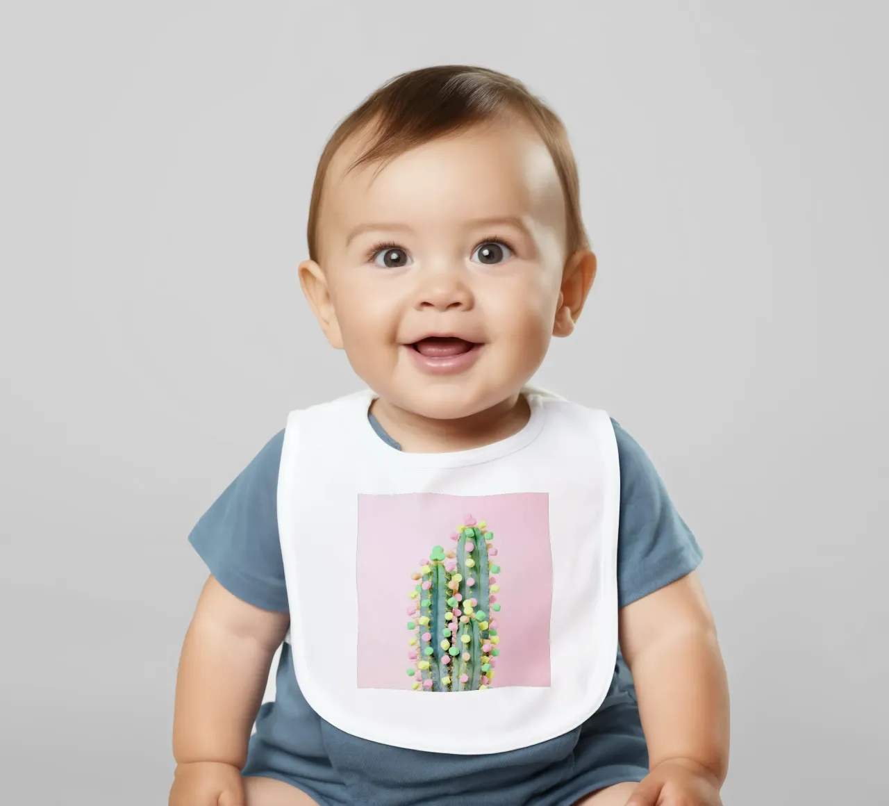 Marshmallow Cactus in Bloom baby bib by Juj Winn
