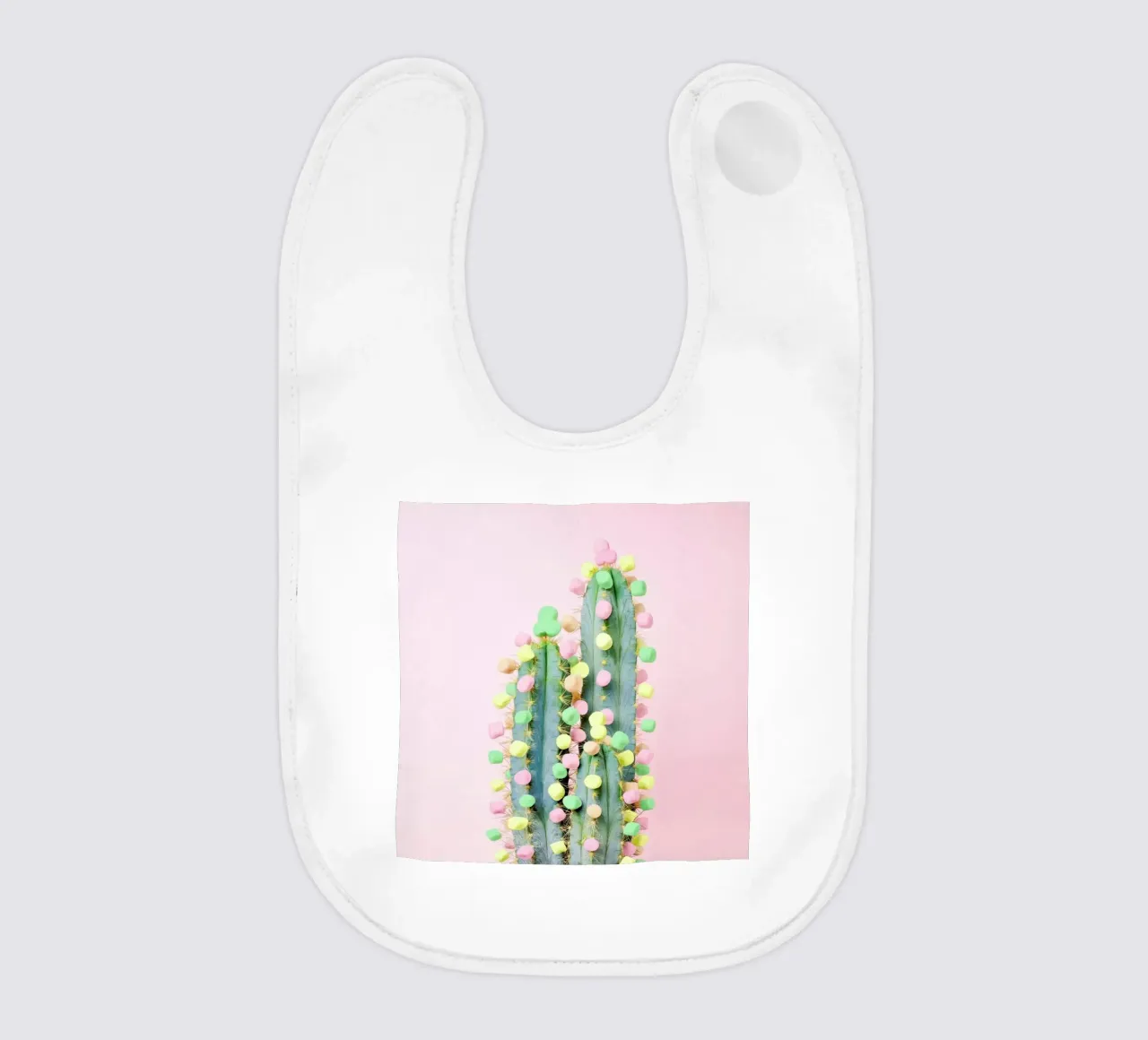 Marshmallow Cactus in Bloom baby bib by Juj Winn