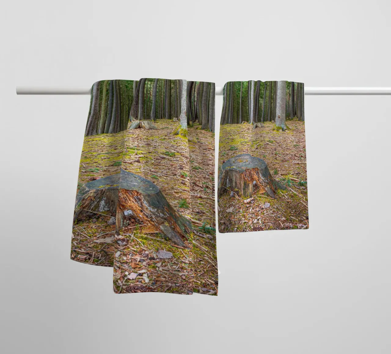 Tree stump in a dense coniferous forest towel by Marcus Beckert | Fotografie