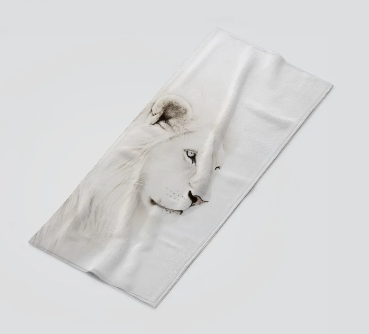 white lion of the wilderness beach towel by Carinaprint