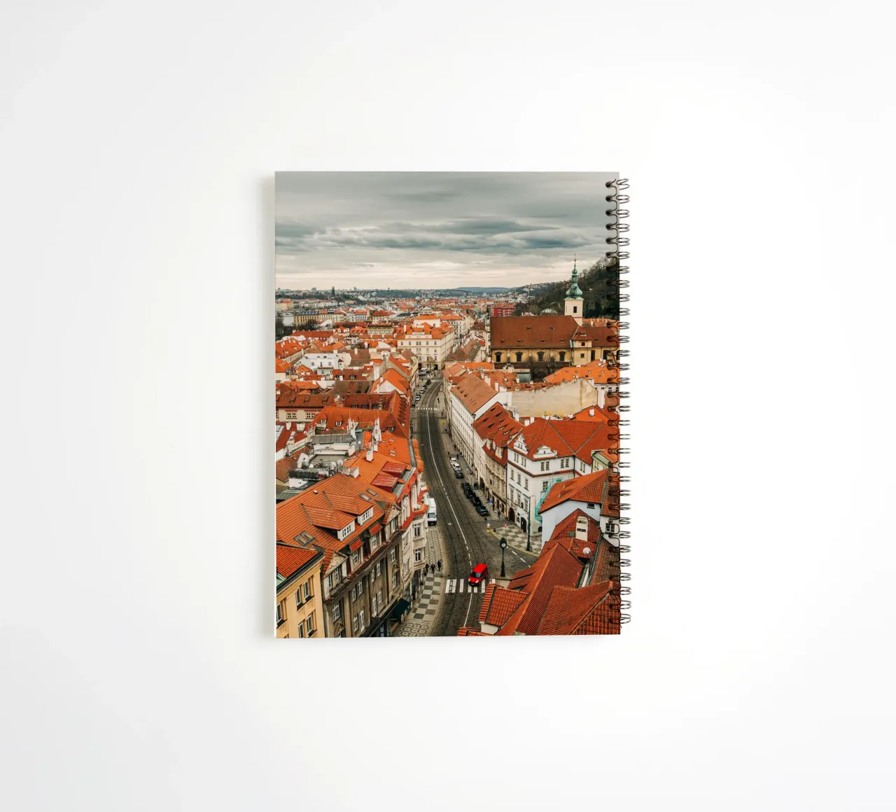 Red roofs in Prague - Dark clouds over the city spiral notebook by Bold and Retro