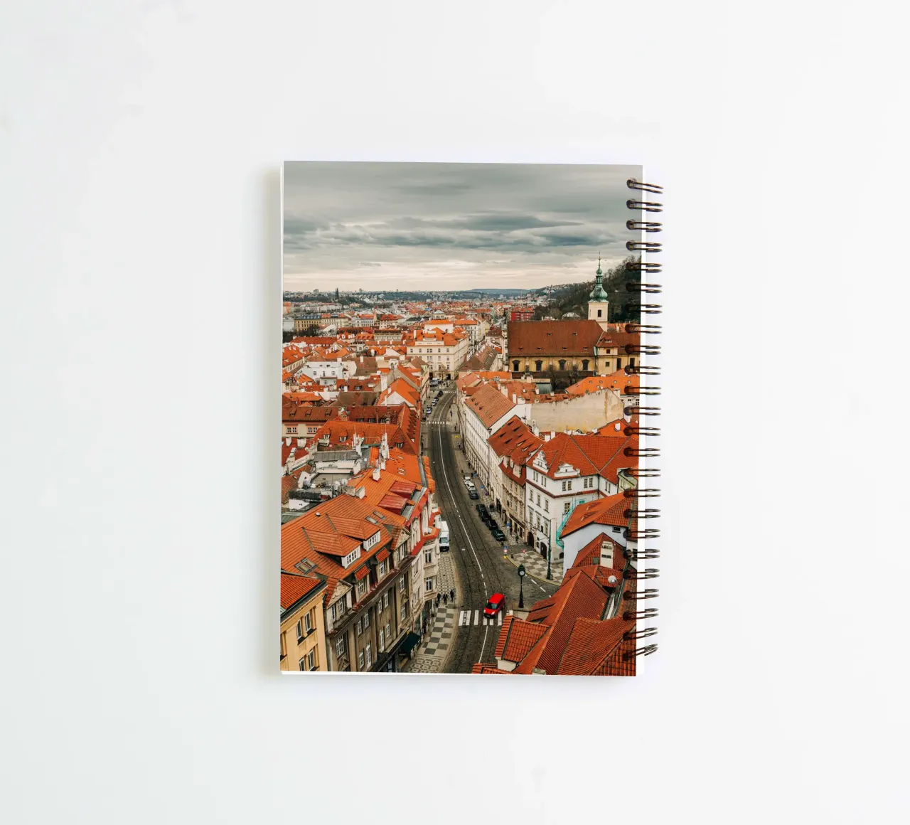 Red roofs in Prague - Dark clouds over the city spiral notebook by Bold and Retro