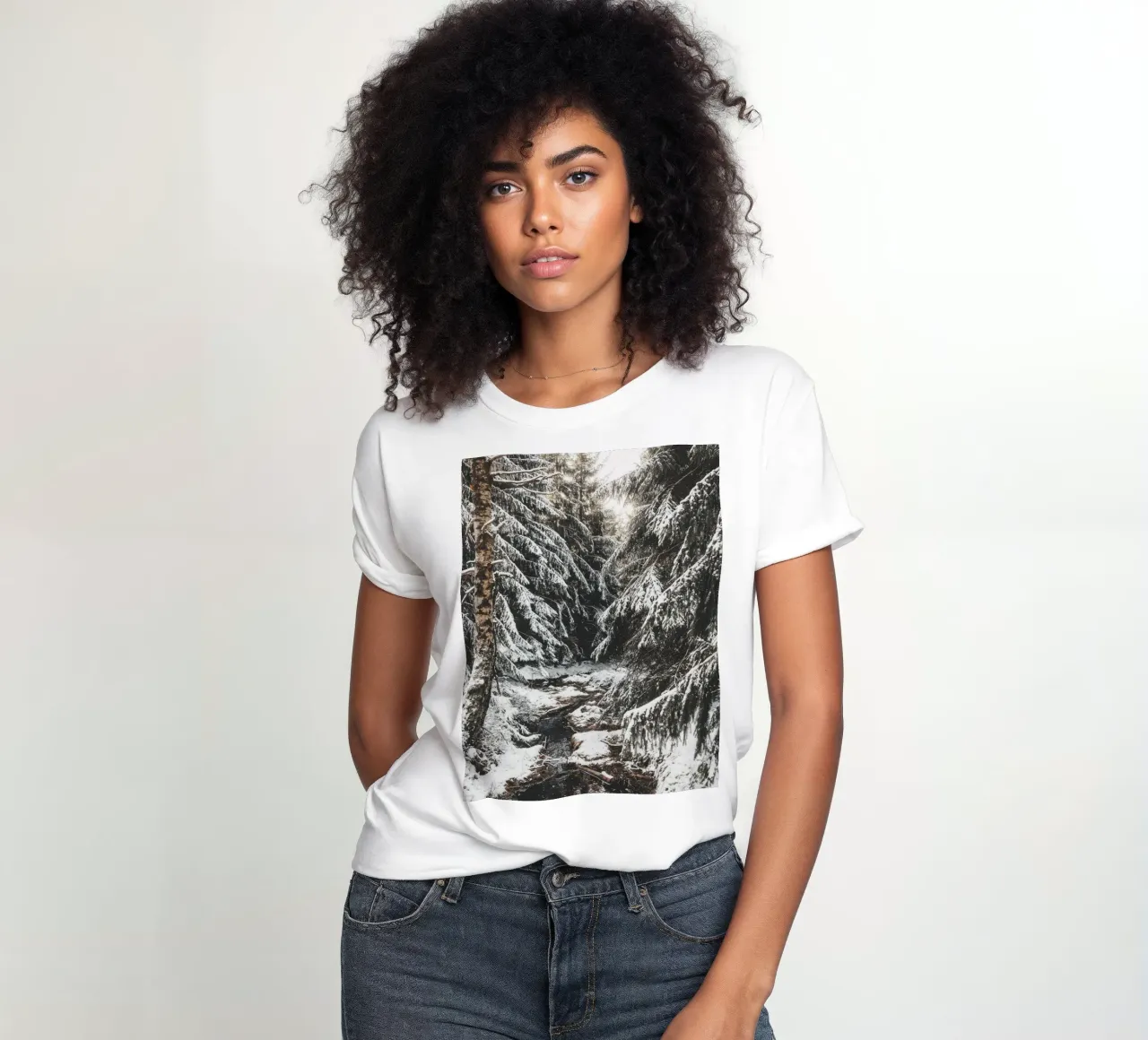 Enchanting winter forest with stream and snow-covered trees women's fitted t-shirt by Bold and Retro