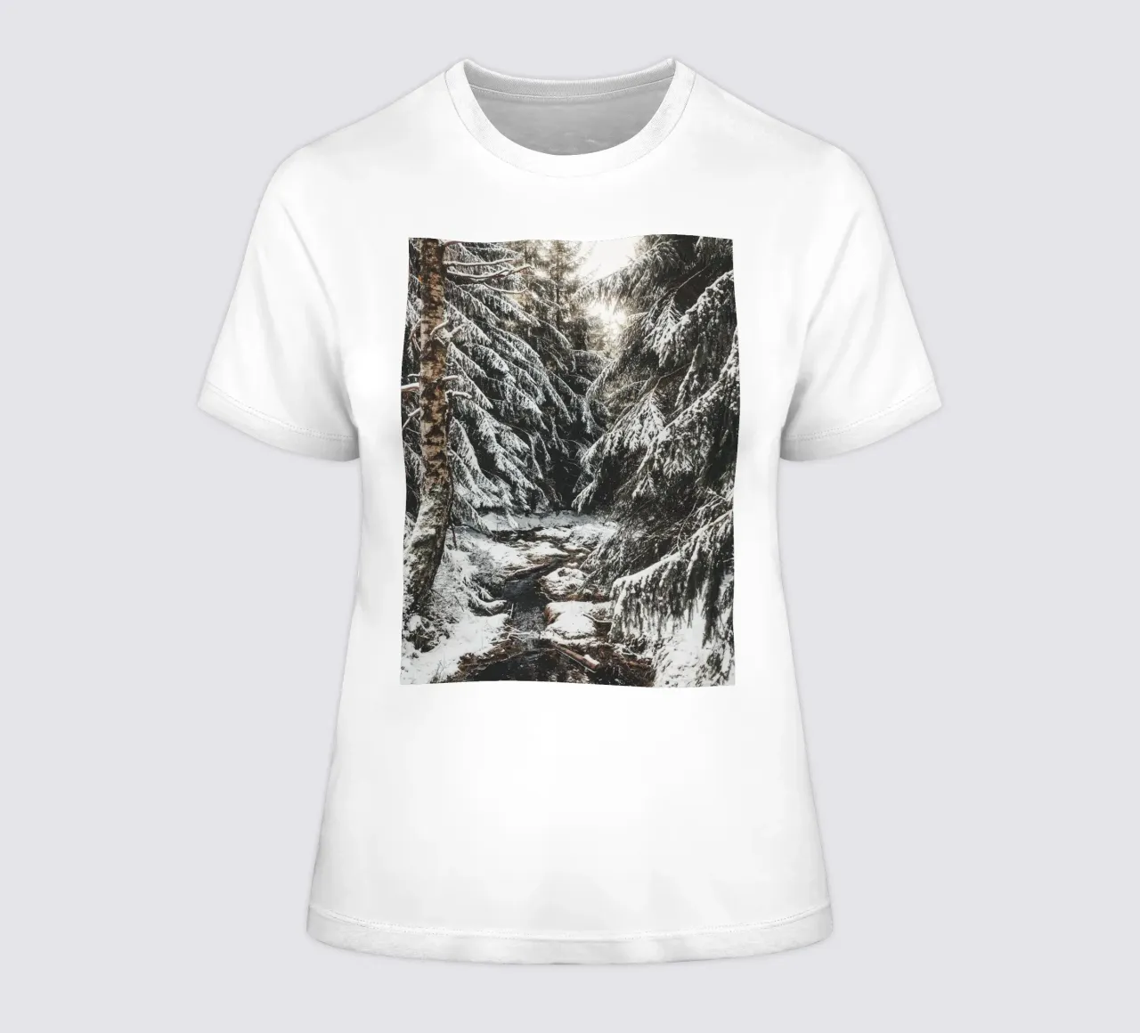 Enchanting winter forest with stream and snow-covered trees women's fitted t-shirt by Bold and Retro