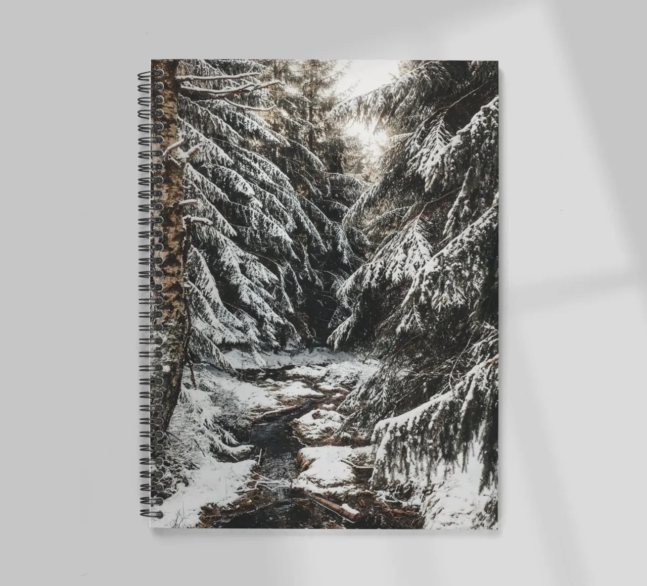 Enchanting winter forest with stream and snow-covered trees spiral notebook by Bold and Retro