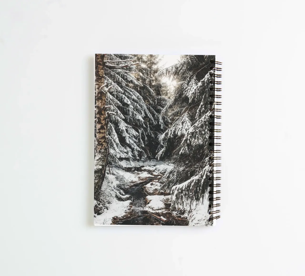 Enchanting winter forest with stream and snow-covered trees spiral notebook by Bold and Retro