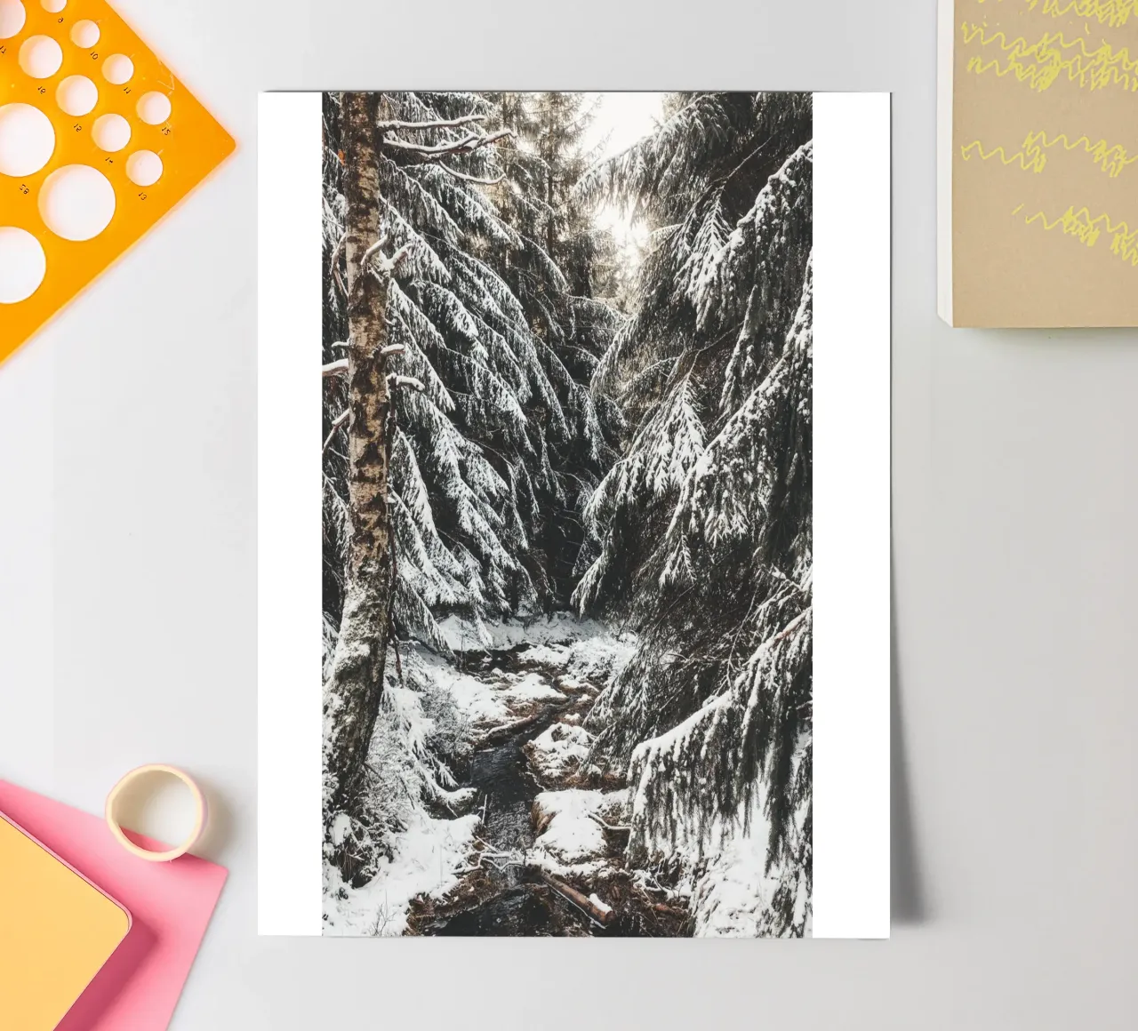 Enchanting winter forest with stream and snow-covered trees sticker sheet by Bold and Retro