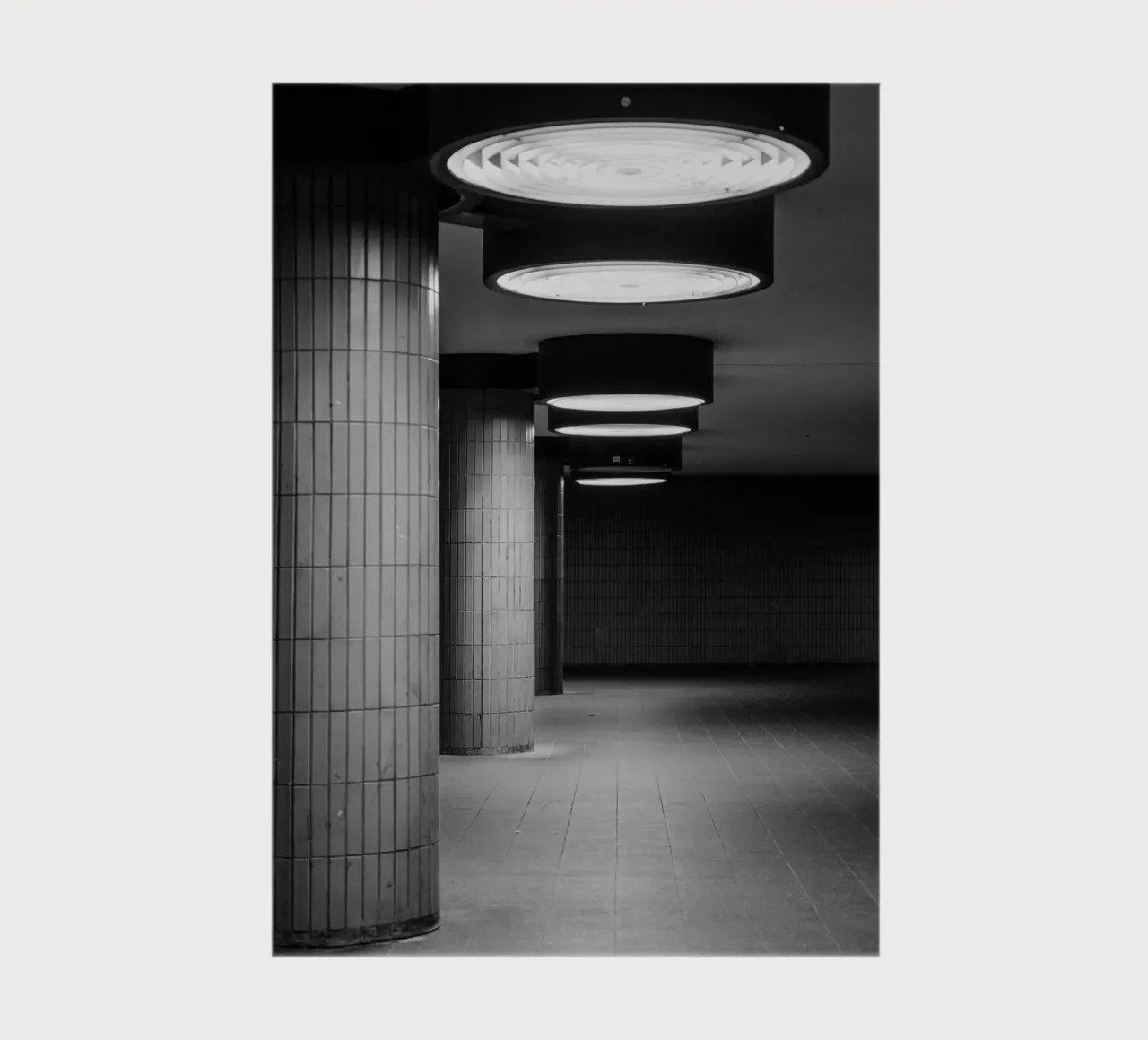 Black and white photo Berlin: Shadow play in a dark tunnel notebook by Bold and Retro