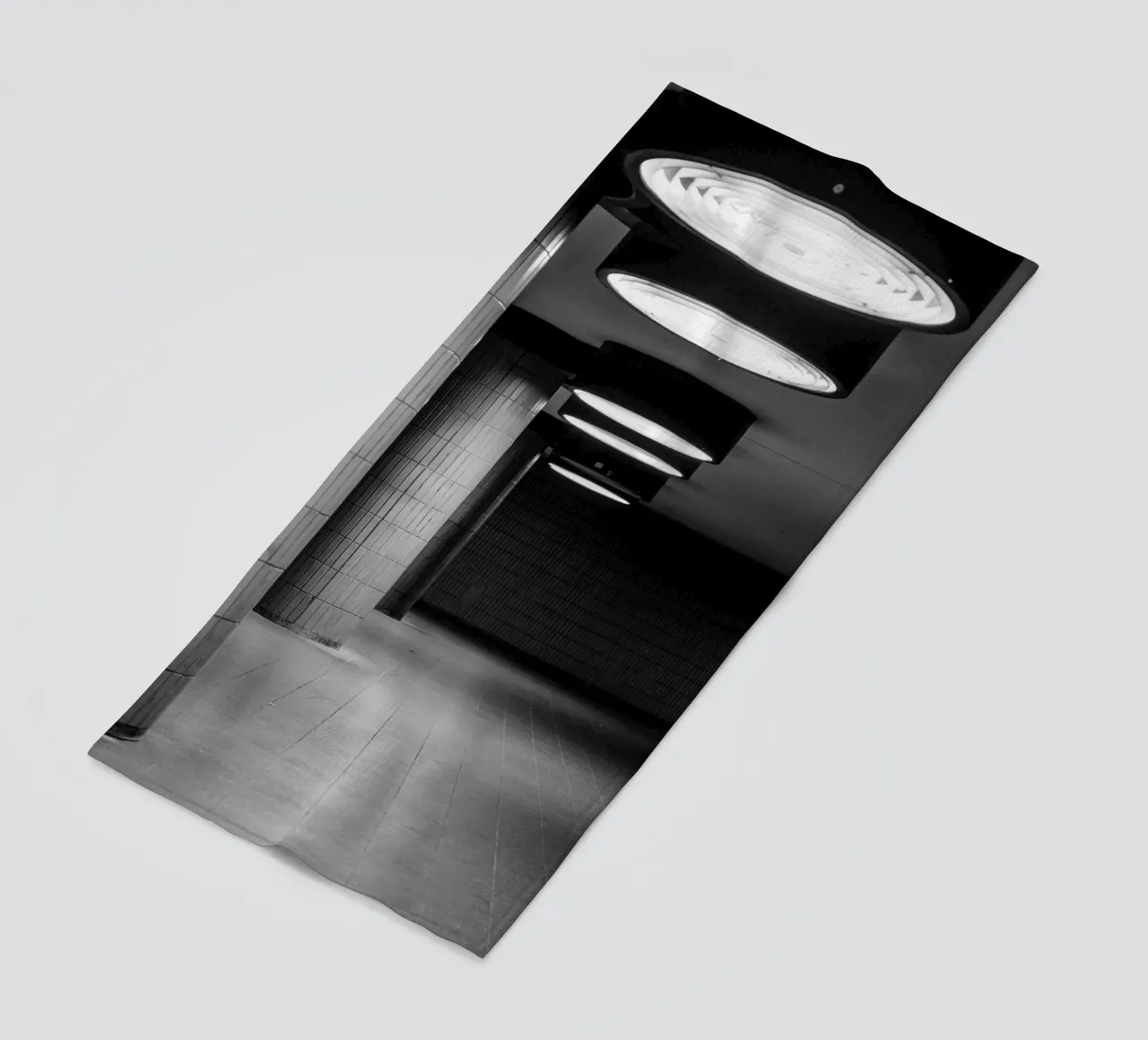 Black and white photo Berlin: Shadow play in a dark tunnel beach towel by Bold and Retro