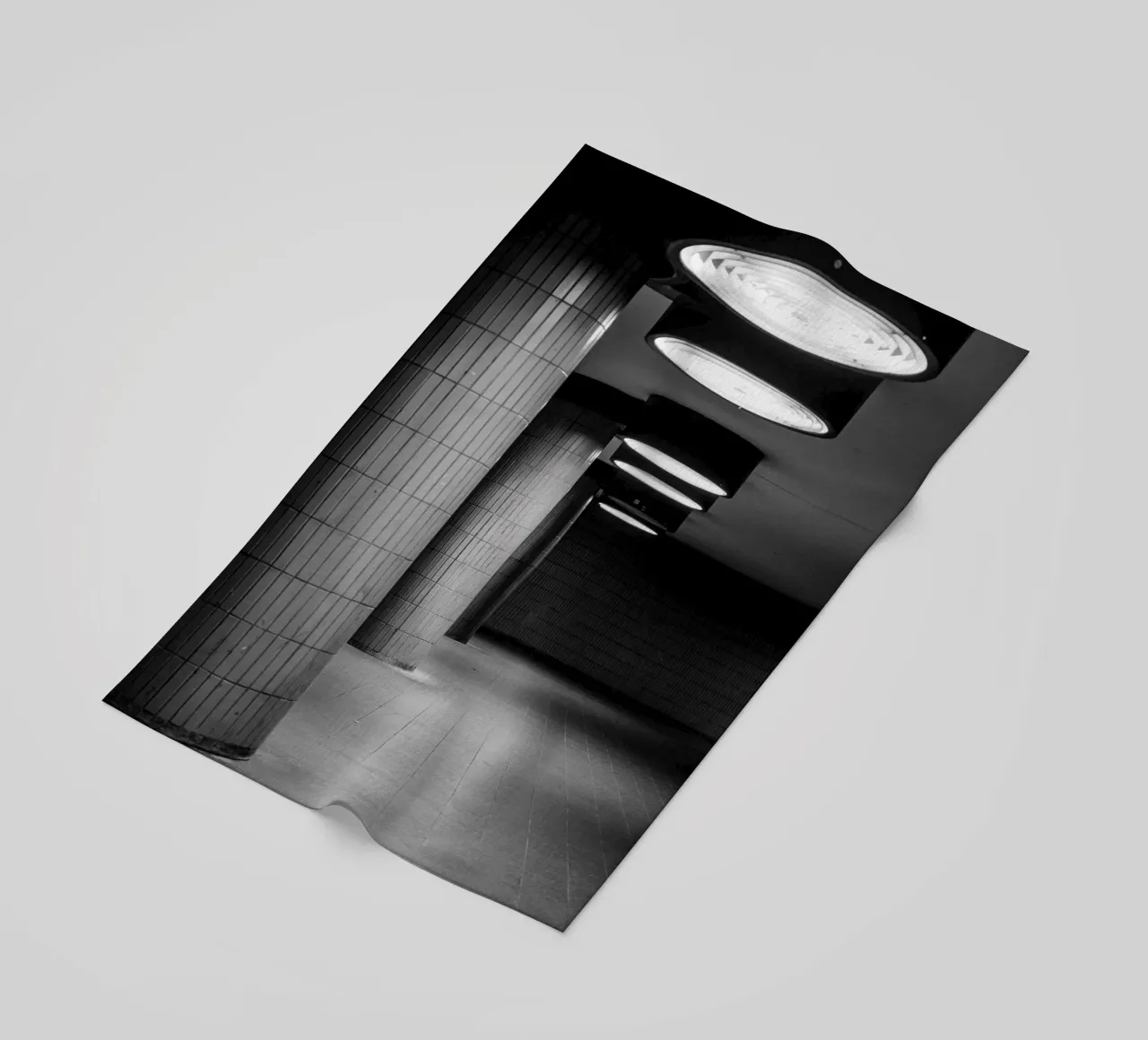 Black and white photo Berlin: Shadow play in a dark tunnel beach towel by Bold and Retro