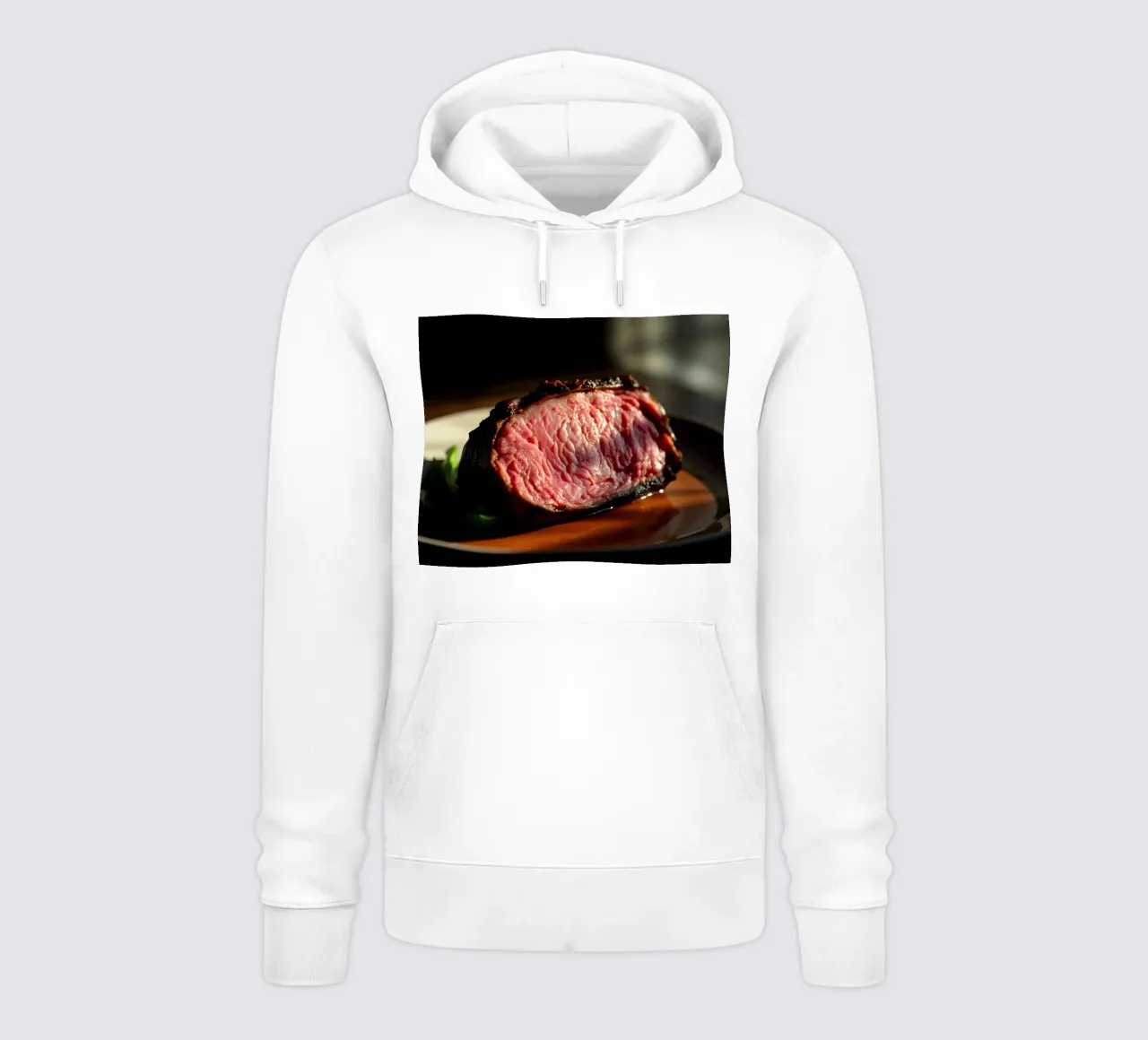 Bistecca di media cottura perfettamente cotta e servita su un piatto scuro felpa con cappuccio da DesignDoodle