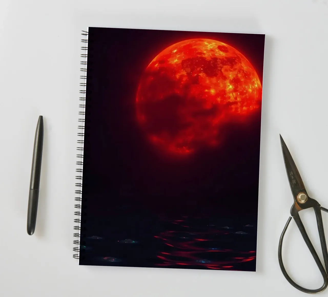 Moon reflects on dark water during a celestial event spiral notebook by DesignDoodle