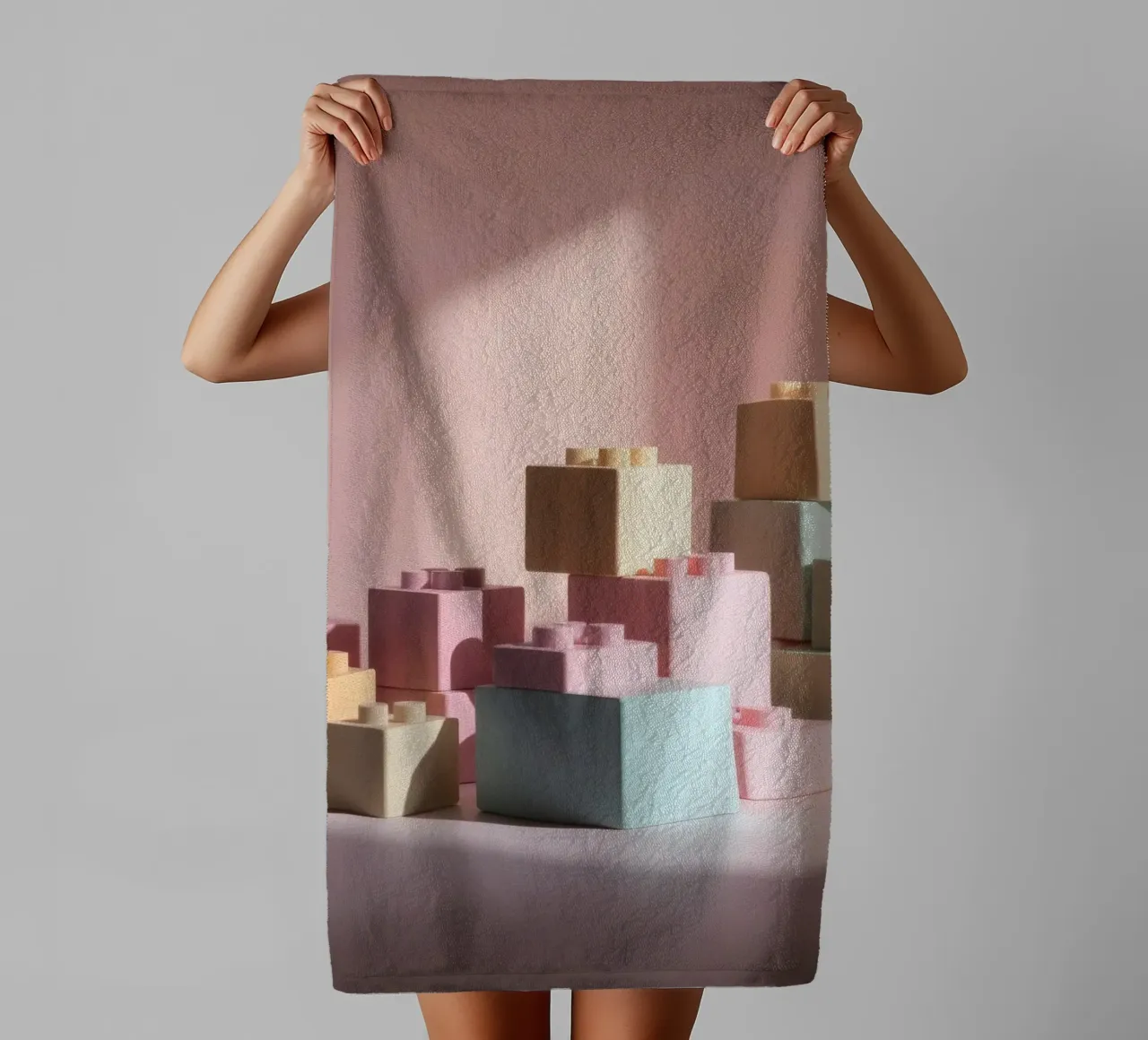 Colorful building blocks arranged in a playful geometric towel by DesignDoodle