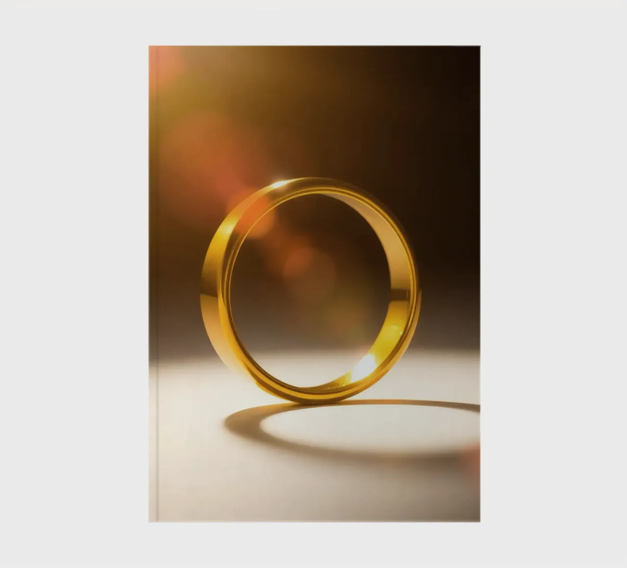 Elegant gold ring glimmers under soft light notebook by DesignDoodle