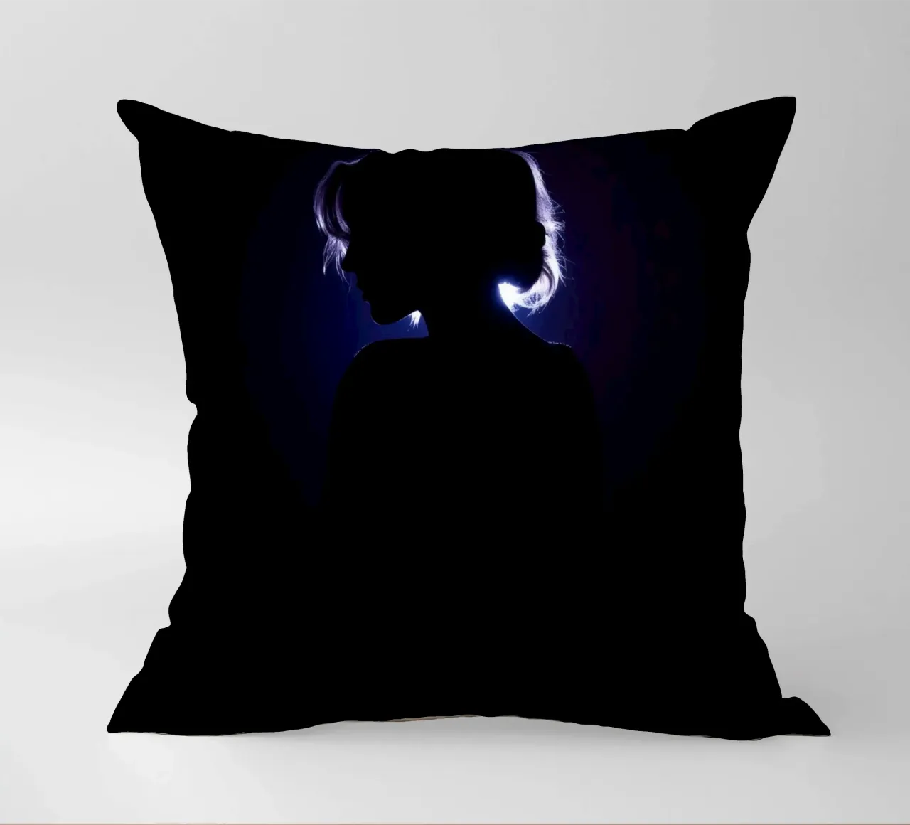 Silhouette of a child against a dark background illuminated decorative cushion by DesignDoodle