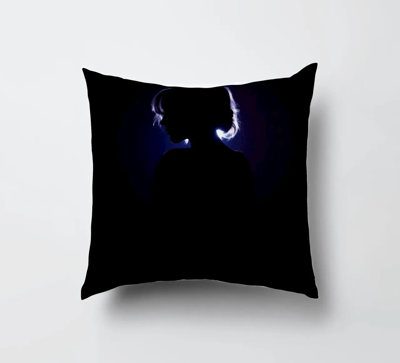 Silhouette of a child against a dark background illuminated decorative cushion by DesignDoodle