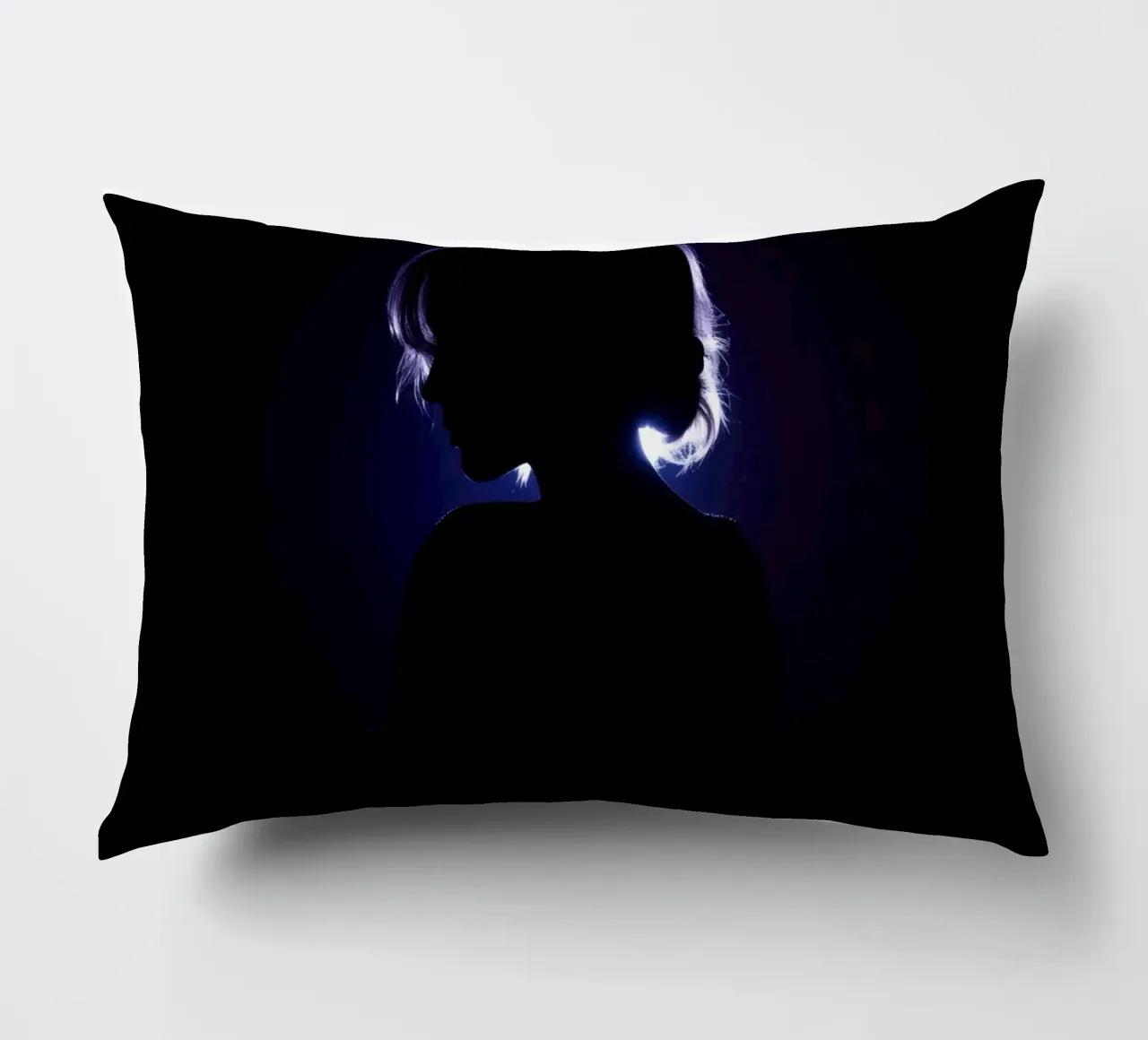 Silhouette of a child against a dark background illuminated decorative cushion by DesignDoodle