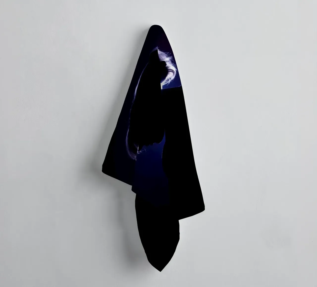 Silhouette of a child against a dark background illuminated towel by DesignDoodle