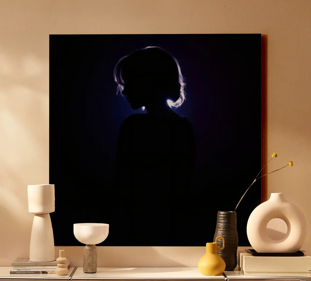 Silhouette of a child against a dark background illuminated canvas by DesignDoodle