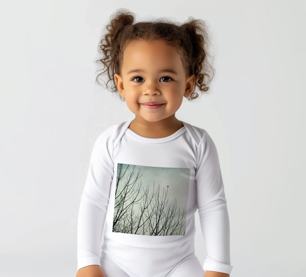 Lonely Heart long-sleeve baby romper by Ingrid Beddoes