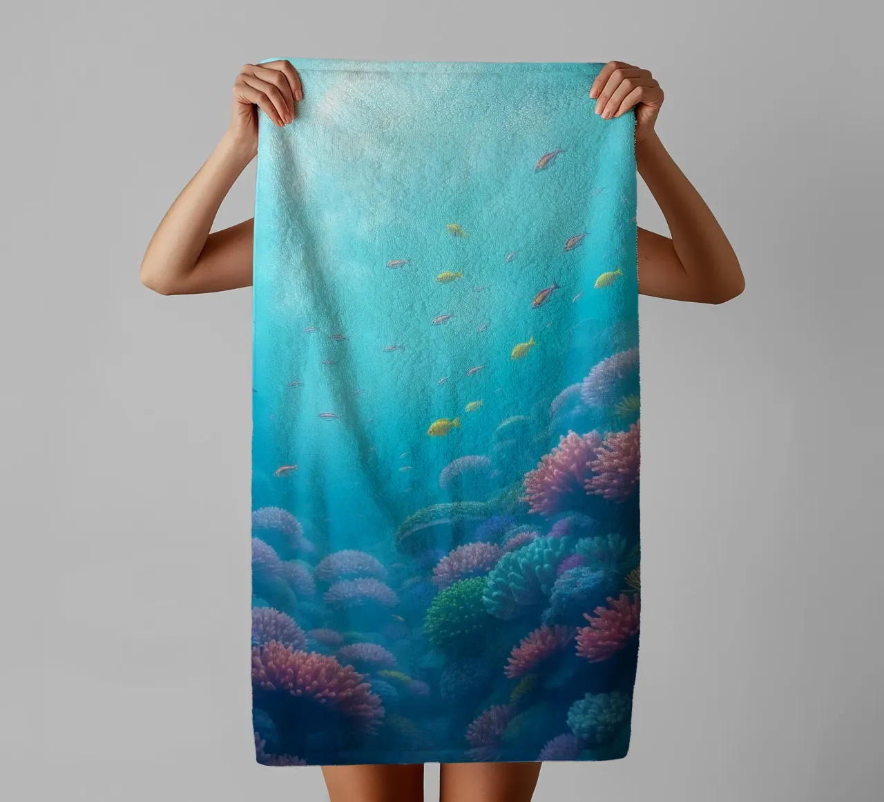 Vibrant underwater coral reef teeming with colorful fish in towel by DesignDoodle